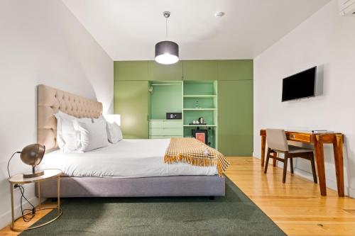 Una cama o camas en una habitación de Monte Belvedere Hotel by Shiadu