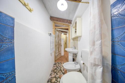 a bathroom with a toilet and a sink at Guest House Fontanelle in Ugento