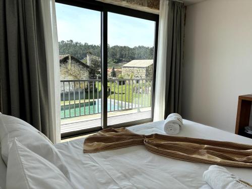 Ένα ή περισσότερα κρεβάτια σε δωμάτιο στο Paços de Douro - Chambre 4 Charme & Calme