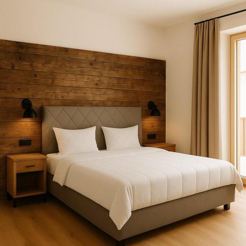 Una cama o camas en una habitación de Kleinberg Chalet