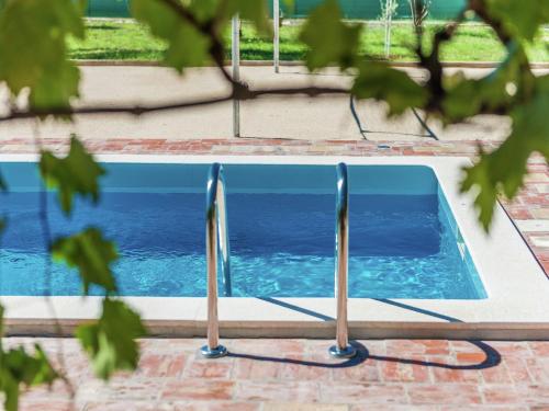 a swimming pool in a yard with trees at Holiday Home in Zemunik Donji with Pool in Donji Zemunik