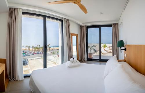 Ένα ή περισσότερα κρεβάτια σε δωμάτιο στο Hotel Apartamentos Hamus