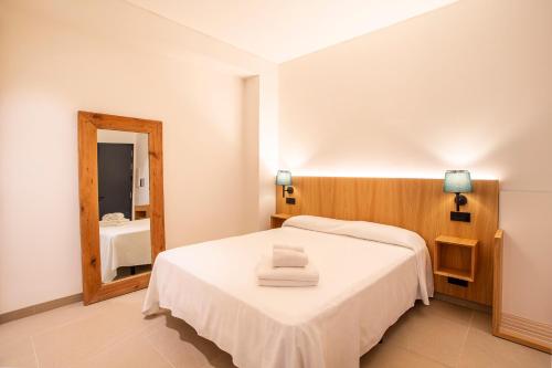 Ένα ή περισσότερα κρεβάτια σε δωμάτιο στο Hotel Apartamentos Hamus