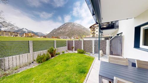 a balcony of a house with a view of a mountain at Appartements Am Achensee in Pertisau