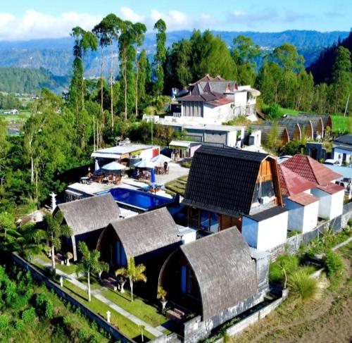 an aerial view of a house with a pool at Bali Cottages Lake View in Kintamani