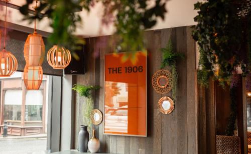 a sign on the wall of a restaurant with lights at Royal Hotel in Cumnock