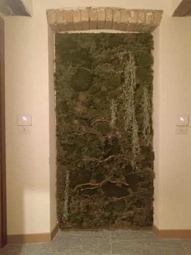 a wall in a room with a stone wall at Langhe & Wine Accommodation in Neive
