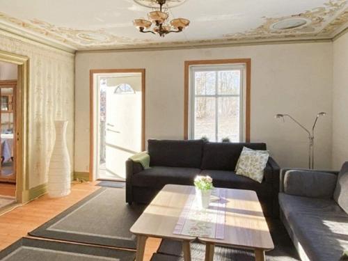 a living room with a couch and a table at 5 person holiday home in KUNGSHAMN in Kungshamn