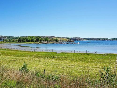 a view of a body of water with a beach at 5 person holiday home in KUNGSHAMN in Kungshamn