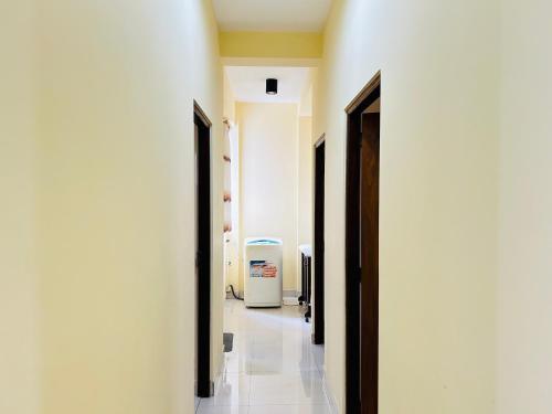 a hallway with two open doors to a room at Ivy Valley in Kandana