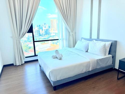 Katil atau katil-katil dalam bilik di Elite Service Suite at Opus Residence Merdeka 118