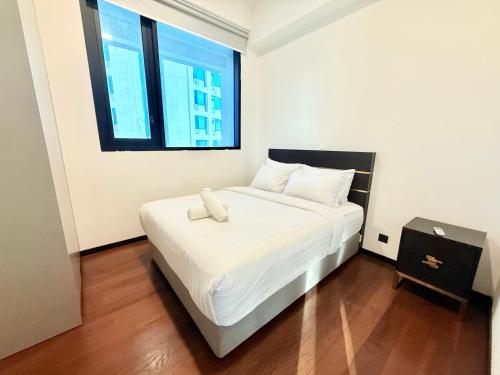Katil atau katil-katil dalam bilik di Elite Service Suite at Opus Residence Merdeka 118