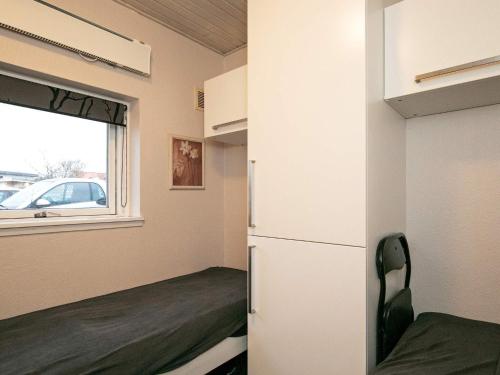 a small room with a refrigerator and a window at Marina Retreat in Aero - By Traum Ferienwohnungen in Ærøskøbing