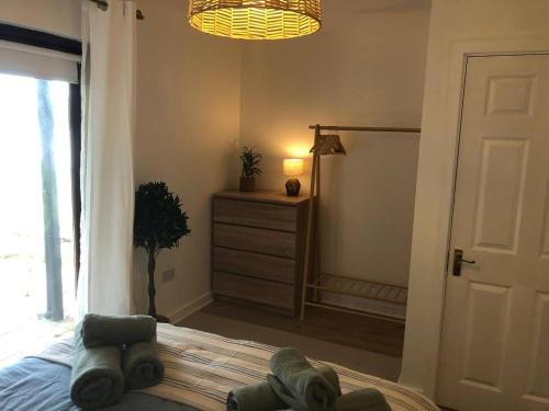 a bedroom with a bed with stuffed animals on it at Bayview Villa Costal Retreat in Youghal