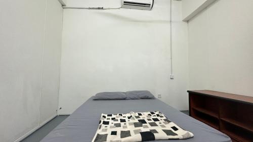 Ένα ή περισσότερα κρεβάτια σε δωμάτιο στο Jiaxin Dormitory - Puteri Wangsa 家馨旅舍