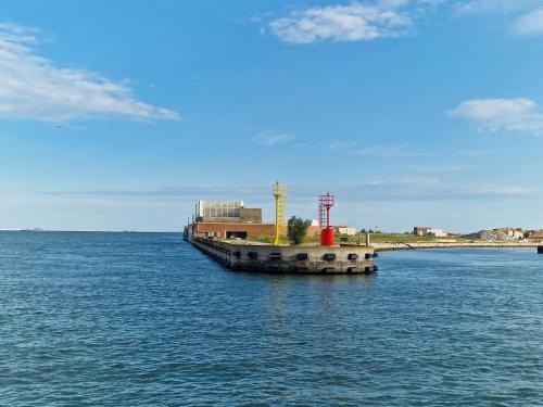 a barge in the middle of a large body of water at Il Glicine di Marco Polo in Cavallino-Treporti