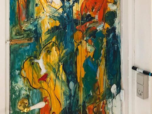 a painting on the door of a room at Cozy Seaside Retreat in Hojer-By Traum in Højer