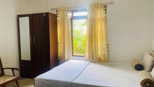 Postel nebo postele na pokoji v ubytování Ramboda Jungle Resort