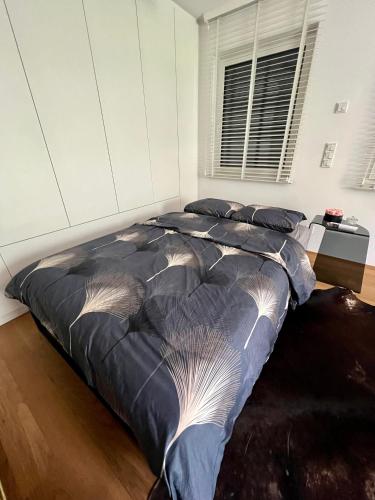 a large bed in a room with a bed sidx sidx sidx at Lux city apartment in Luxembourg
