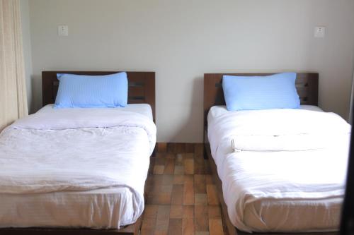 Ein Bett oder Betten in einem Zimmer der Unterkunft Hotel RB Lake
