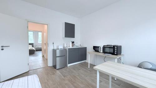 Η κουζίνα ή μικρή κουζίνα στο Studio-Apartments für Monteure & Businessgäste Zentral in Neumünster