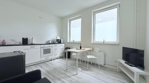 Η κουζίνα ή μικρή κουζίνα στο Studio-Apartments für Monteure & Businessgäste Zentral in Neumünster