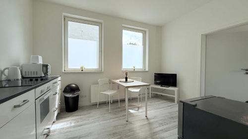 Η κουζίνα ή μικρή κουζίνα στο Studio-Apartments für Monteure & Businessgäste Zentral in Neumünster