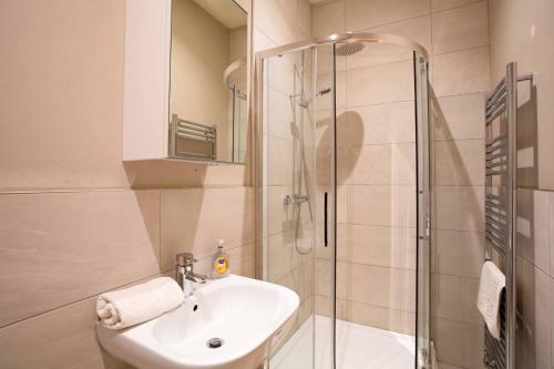a bathroom with a sink and a shower at Boutique Central 2 bed In Harrogate - Sleeps 6 in Harrogate