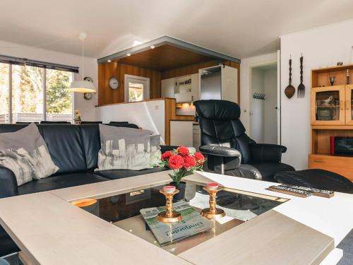 a living room with a couch and a table at 7 person holiday home in Spøttrup in Spottrup
