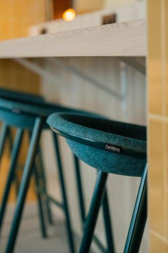 two blueools under a counter with a table at Citybox Brussels in Brussels