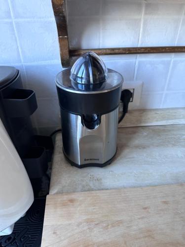 a pot sitting on the floor in a kitchen at B&B Villa Aurea in Anguillara Sabazia