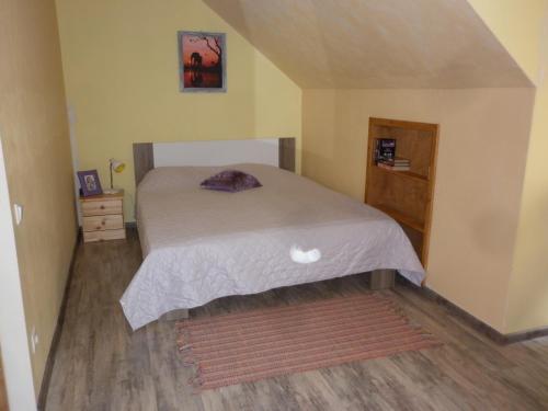 a bedroom with a bed and a wooden floor at Kuldkaru Manor in Valaste