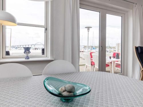 a teddy bear sitting in a bowl on a table at Harbor Retreat in Rudkobing - By Traum Ferienwohnungen in Rudkøbing