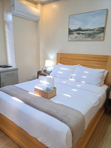 Ένα ή περισσότερα κρεβάτια σε δωμάτιο στο Tungkip House Bed and Breakfast