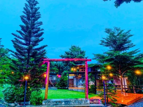 a pavilion in a park at night at Heaven Hill Camping in Ban Thung Na