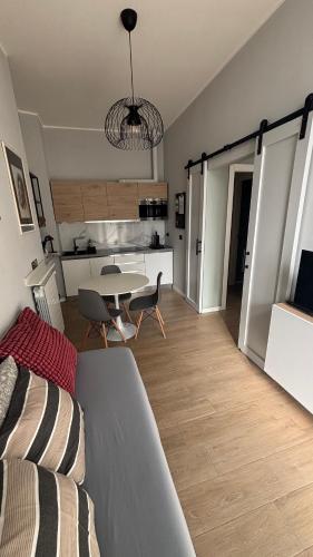 a living room with a couch and a table at La Casetta in Burago di Molgora