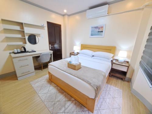 Ένα ή περισσότερα κρεβάτια σε δωμάτιο στο Tungkip House Bed and Breakfast