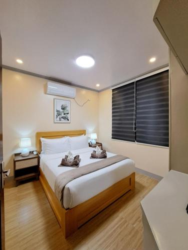 Katil atau katil-katil dalam bilik di Tungkip House Bed and Breakfast