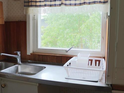 a kitchen counter with a sink and a window at 5 person holiday home in MELLBYSTRAND-By Traum in Mellbystrand