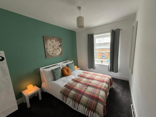 a bedroom with a bed and a window at Duke's Retreat - 4 BR Sleeps 8 Ideal 4 Contractors in Consett