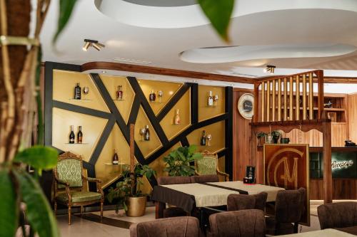 a dining room with a table and chairs at Edemus - Motel & Restaurant in Maglaj