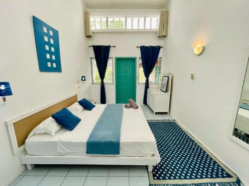 Ένα ή περισσότερα κρεβάτια σε δωμάτιο στο Mont Choisy Lodge - Coral Apartment