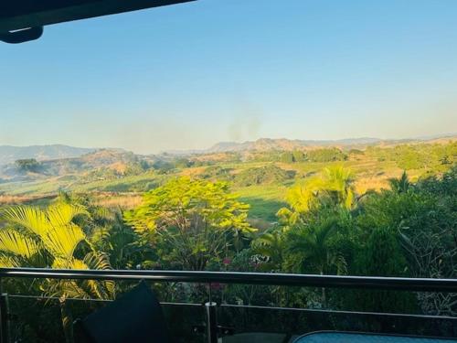 a view of a valley with mountains in the background at Vale Kau in Nadi