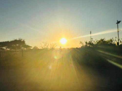 a sunset with the sun in the sky at Vale Kau in Nadi