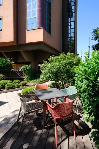 a table and chairs sitting on a patio at Ibis Budapest Heroes Square in Budapest