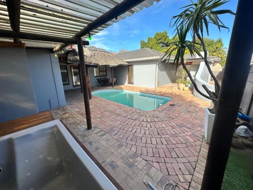 a swimming pool in the backyard of a house at Joy House in Cape Town