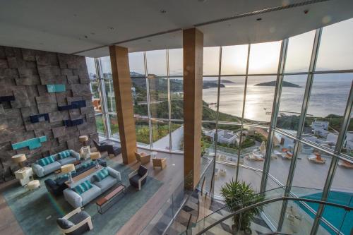 an aerial view of a living room with a view of the ocean at Sirene Luxury Hotel Bodrum in Yalıkavak