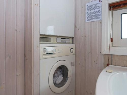 a washing machine in a bathroom next to a toilet at 6 person holiday home in Nordborg-By Traum in Nordborg