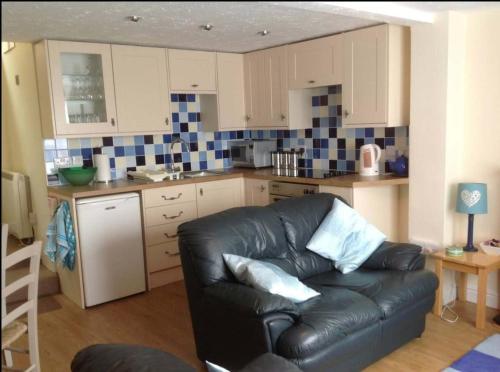 Кухня или мини-кухня в Seymour Cottage
