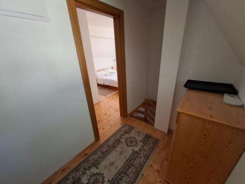 a hallway with a door leading to a bedroom at Tvoja kućica za beg 2 in Plešin